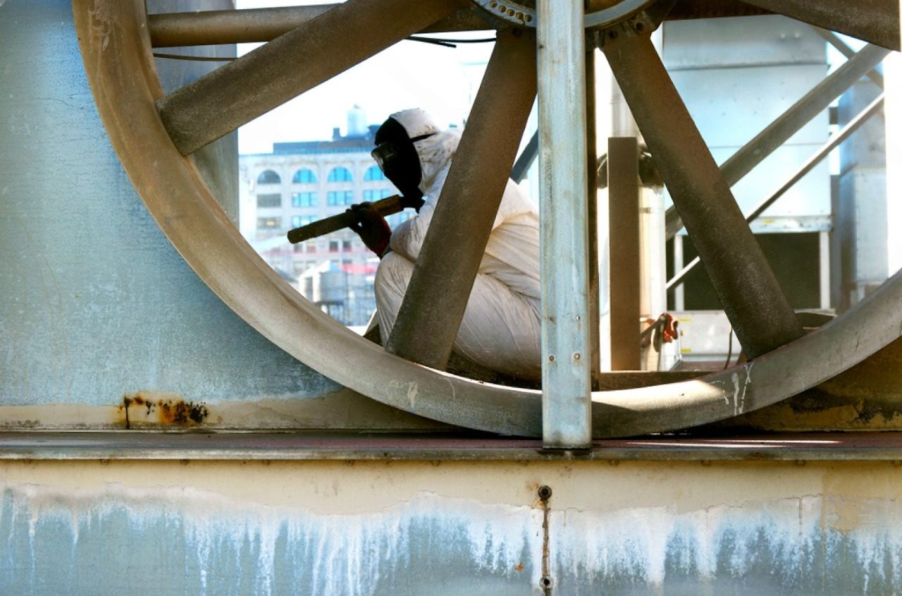 sandblasting near me gold coast stock photo sandblaster vapor blasting in cooling tower dustless sandblasting rusted metal 1298888626 e1779442807975