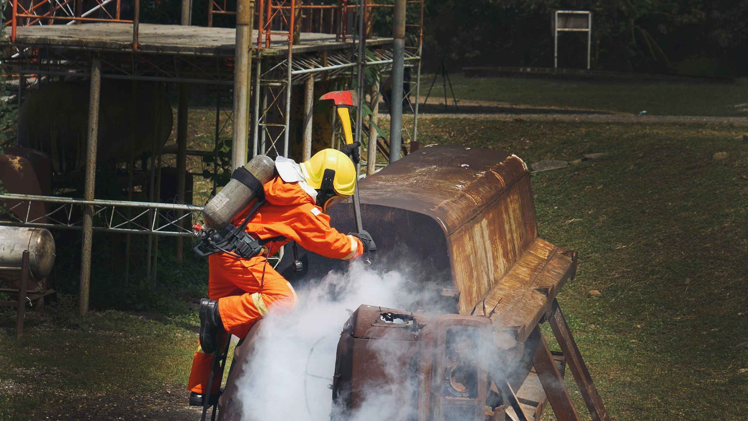 Vapor Blasting firefighter in protective gear using axe during re 2026 05 04 18 04 22 utc scaled