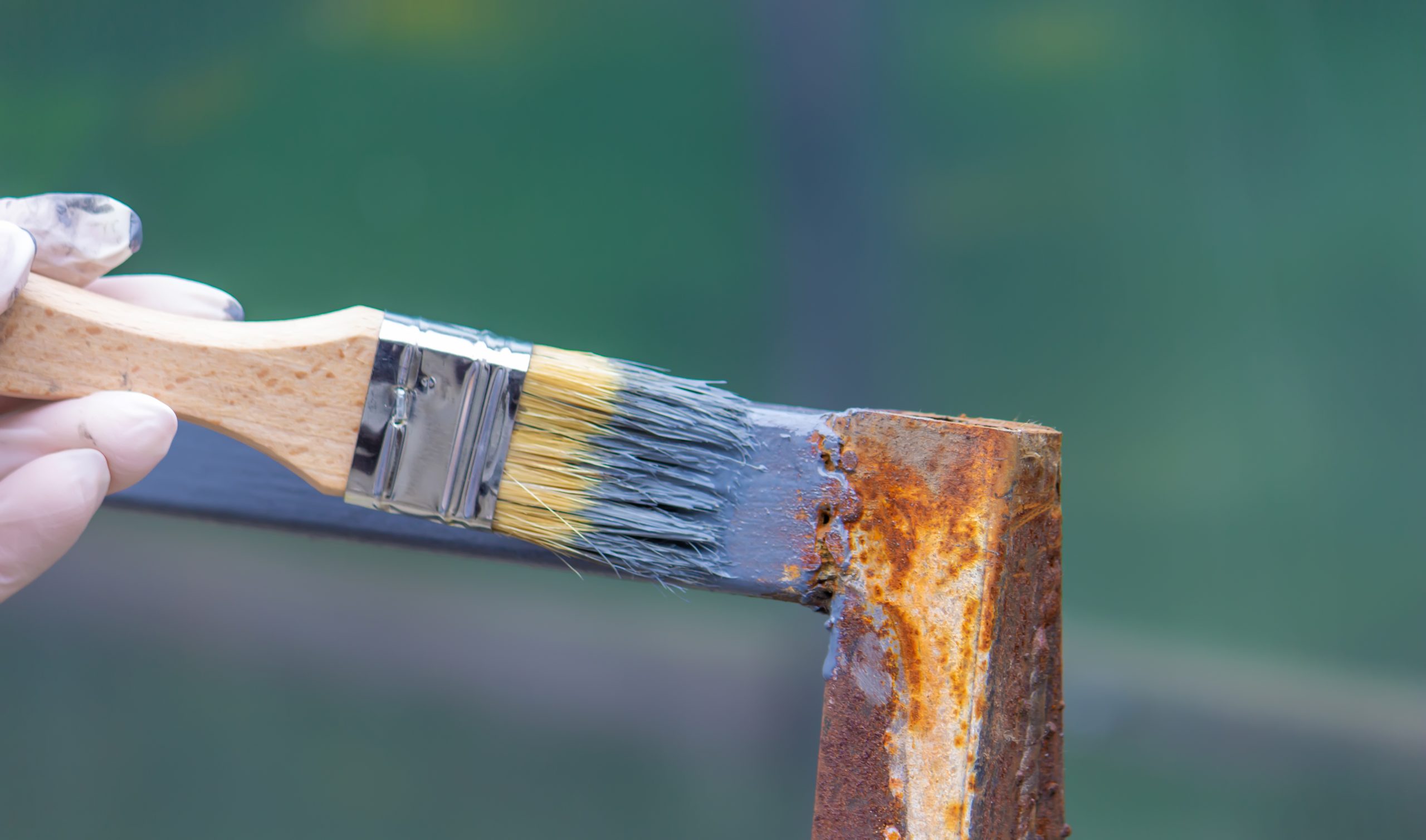 paintbrush applying fresh gray paint to metal 2026 03 24 07 05 10 utc scaled
