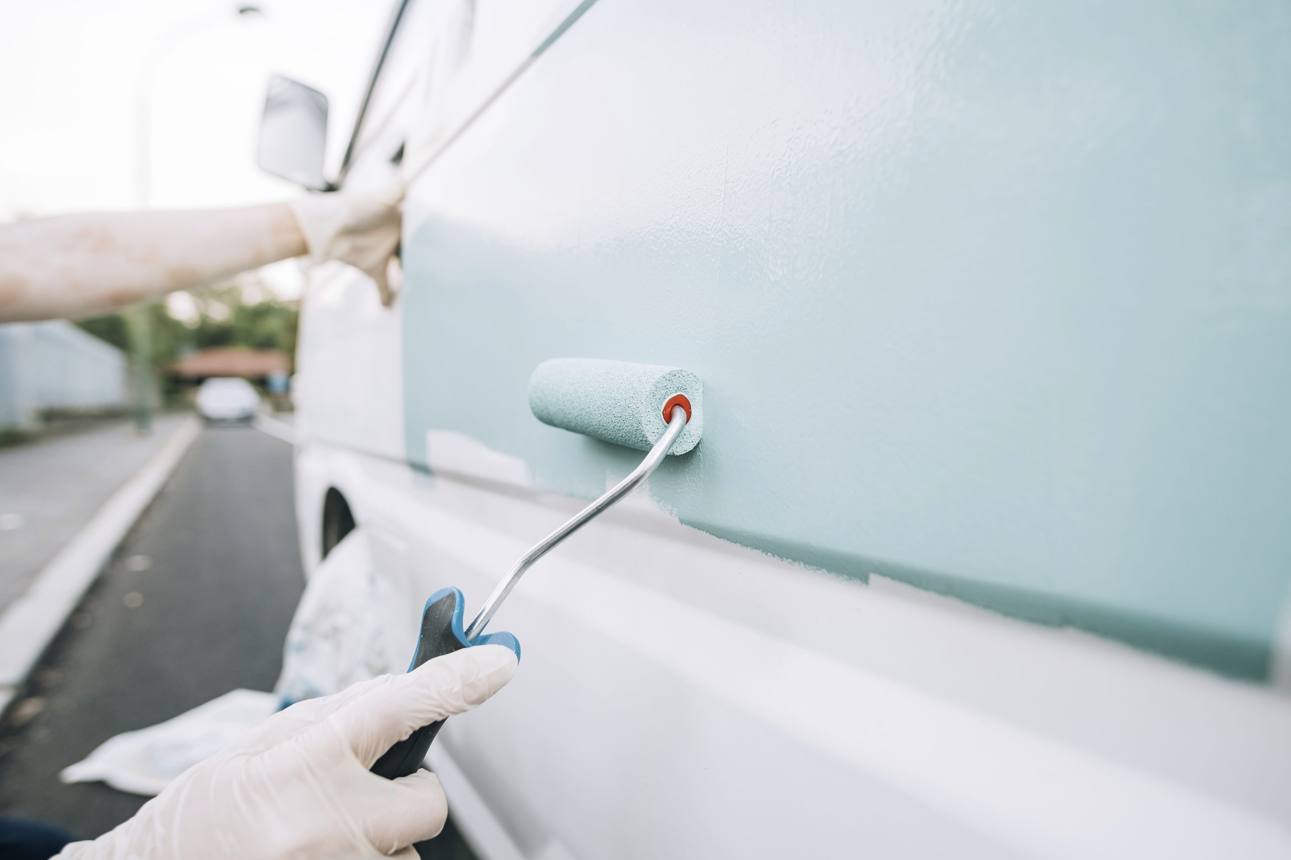 van being painted light blue with paint roller 2026 01 09 09 52 06 utc scaled